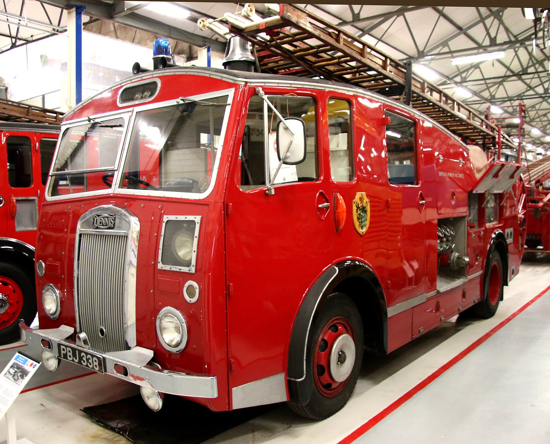 Preserved 1954 Dennis F12 pump escape, registration PBJ 338, displayed inside Ipswich Transport Museum.